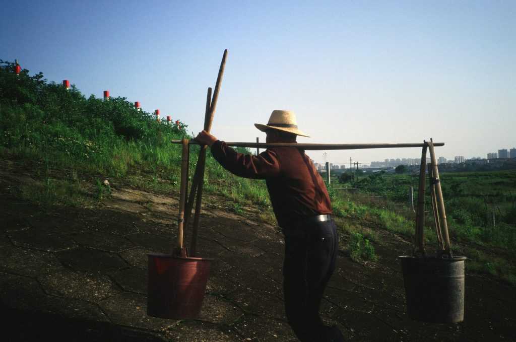 farmer with buckets 